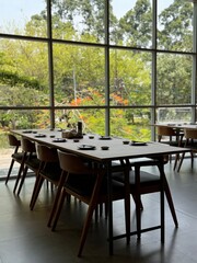 aesthetic wooden table and chairs in restaurant