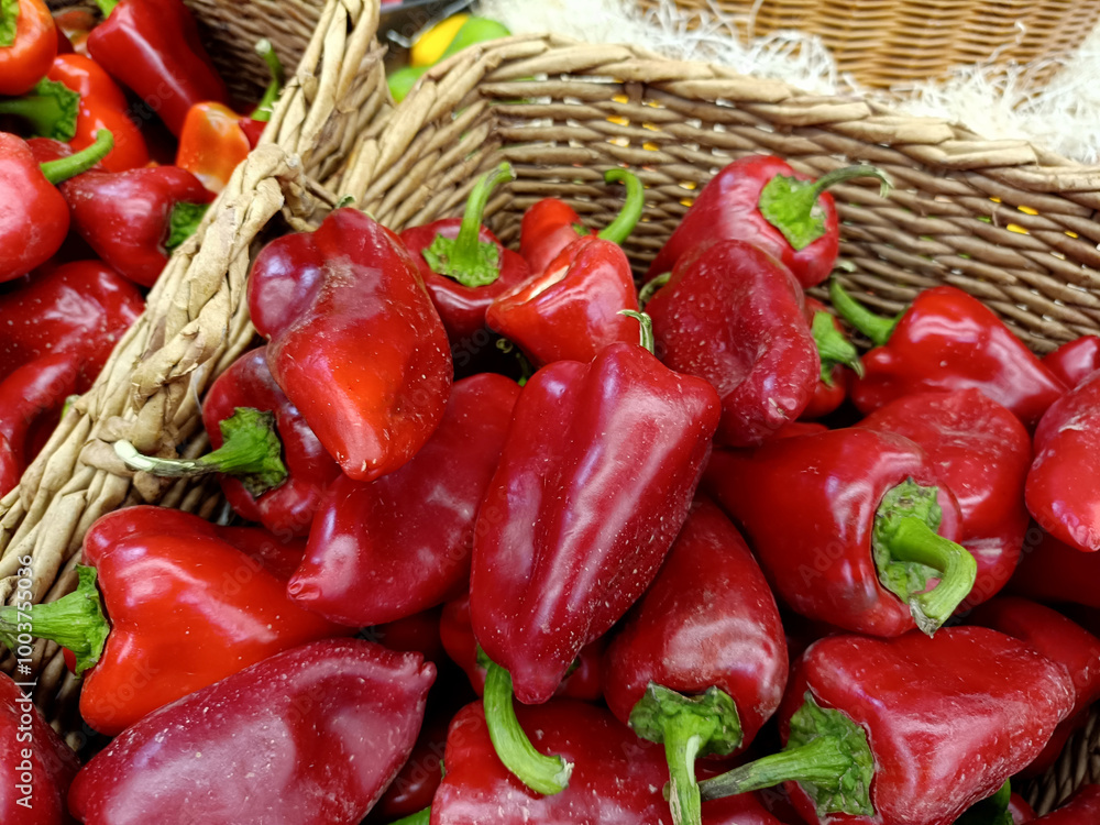 Wall mural straw baskets filled with freshly picked red peppers