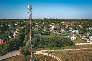 Aerial drone view of 5G telecommunication tower. GSM and radio telecommunication tower. Cell phone...