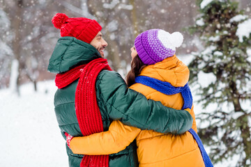 Photo of adorable sweet girlfriend boyfriend dressed vests smiling hugging looking each other...