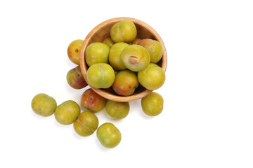 Ripe sweet small mini plum green maroon on white background