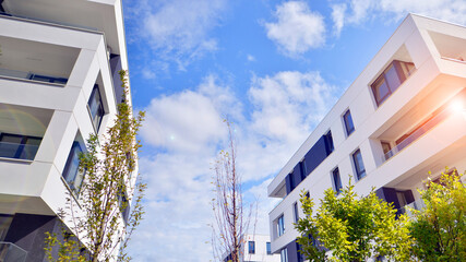 Eco apartment building saving energy and fresh air concept. European residential architecture harmonizing with nature. Eco-friendly living in city with greens. 