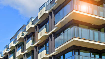 Obraz premium Modern architecture of urban residential apartment buildings on a sunny day. Facade of a modern apartment building.