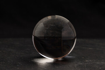 Crystal glass ball on black background