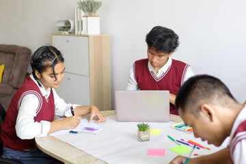 High School Students Doing School Work Together at The Study Room