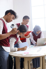 High School Students Doing School Work Together at The Study Room