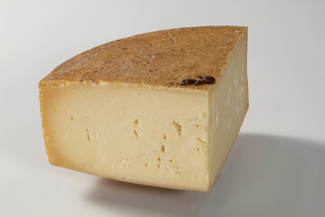 Large slice of cheese on white background