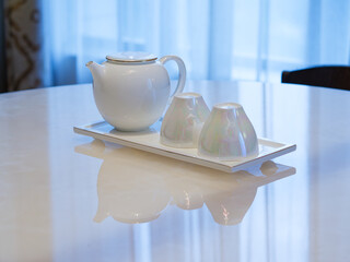 two white tea cups and teapot. Tea concept