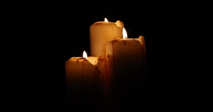Lit candle flame through heavy smoke fog mist vapour flow twist beautiful mistic