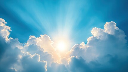 A serene sky with radiant sunlight breaking through fluffy clouds.