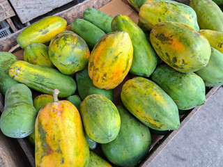 pile of green papaya fruit for sale in the market