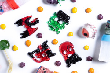 Assortment of Halloween candies isolated on white background. Top view