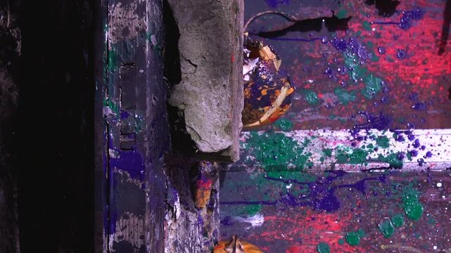 slow motion video art scary Halloween pumpkins and smashing with a heavy big hammer smoke and fire preparing for a celebration in a scary place