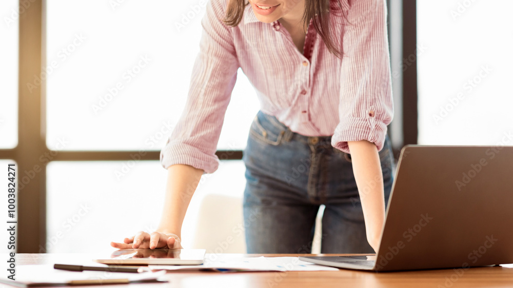 Poster office work. unrecognizable female manager standing at desk using laptop and touching tablet, copysp
