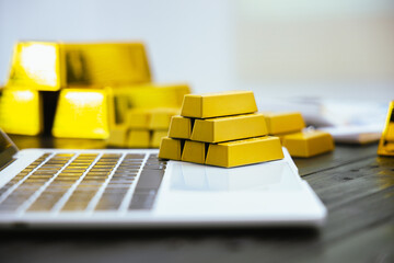 A successful businessman holds a shining gold bar, symbolizing wealth and financial security. The...