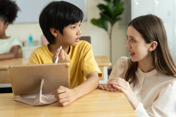 Teacher Guiding Student with Digital Learning in Diverse Classroom