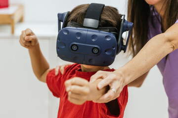 Child wearing virtual reality glasses playing during medical check