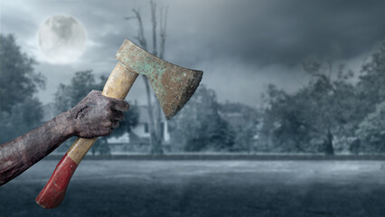 Zombie hands with a bloody wound holding an axe with full moon background. Zombie, devil, evil,...