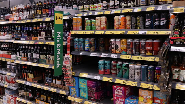 PORTH, MID GLAMORGAN, WALES, UK - SEPTEMBER 30, 2024: BRITISH SHOP MORRISONS ALCOHOL SECTION DRINKS ON SHELVES BEERS AND ALES