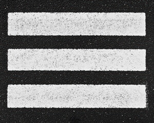 Fototapeta premium Abstract black and white image of three horizontal stripes on a textured background.