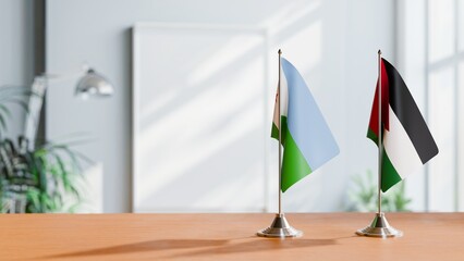 FLAGS OF DJIBOUTI AND JORDAN ON TABLE