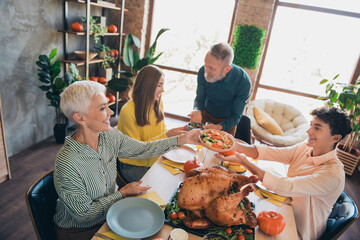 Photo of four relatives family enjoy meeting pass salad talk celebrate thanksgiving dinner apartment indoors