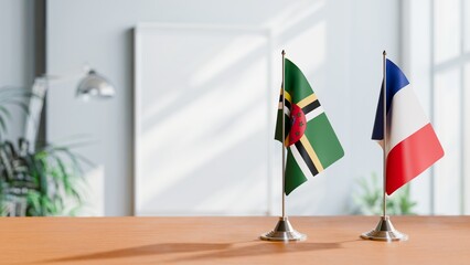 FLAGS OF DOMINICA AND FRANCE ON TABLE