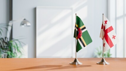 FLAGS OF DOMINICA AND GEORGIA ON TABLE