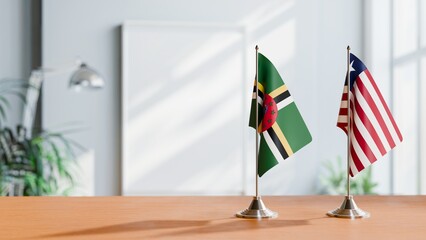 FLAGS OF DOMINICA AND LIBERIA ON TABLE