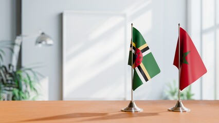 FLAGS OF DOMINICA AND MOROCCO ON TABLE