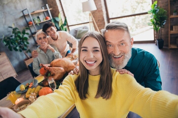 Photo of happy family take selfie photo celebrate thanksgiving holiday dinner relatives living room...