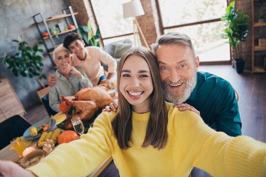 Photo of happy family take selfie photo celebrate thanksgiving holiday dinner relatives living room celebrate weekend