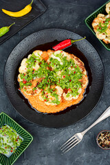 Cauliflower steaks with herb and sauce.