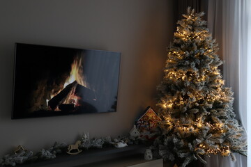 fireplace with christmas tree and decorations