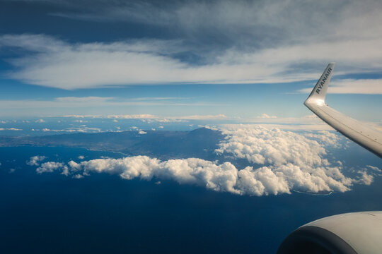 Fototapeta Tenerife seen from a plane during the flight. Teide volcano on the center.