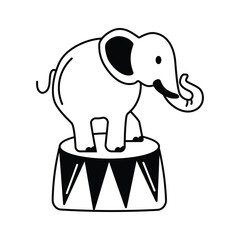 An elephant performing a circus trick, standing on a pedestal