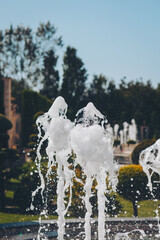 close-up water jet fountain against blue sky. Close up shot of the fountain in the park. Fountain...