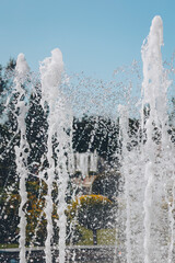close-up water jet fountain against blue sky. Close up shot of the fountain in the park. Fountain...