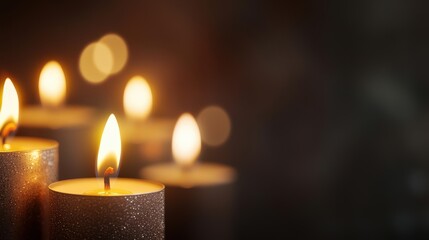 Warm glowing candles on a dark background, creating a serene and tranquil atmosphere for relaxation.