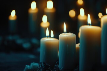 The image showcases a collection of lit wax candles, arranged in an elegant manner. The soft glow and flickering shadows create a warm
