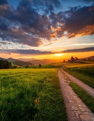 Obraz premium Serene Landscape: Beautiful Sky Above Green Fields and Village