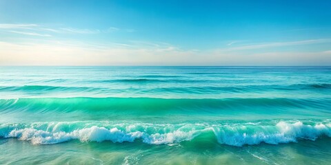 A calming seascape of turquoise blue water gently crashing onto the shoreline, creating a tranquil and serene atmosphere.