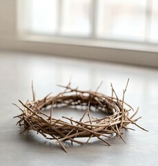 Fototapeta premium This artwork features a shadowy portrayal of Jesus' head adorned with a flowing, thorny crown, set against a textured concrete floor, embodying a powerful Easter theme.