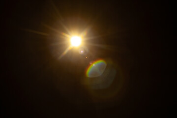 Sun flare on the black background