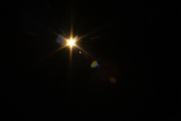 Sun flare on the black background