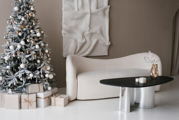 White couch is in front of a Christmas tree in modern living room