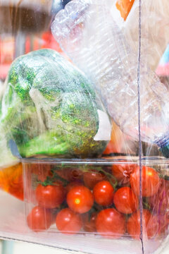 Fresh vegetables in plastic packaging on retail display