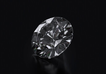 Dazzling diamond with reflection on black background