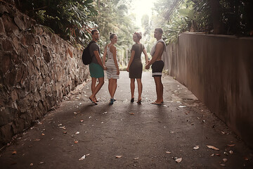 two young couples on vacation four people friends, happiness group person