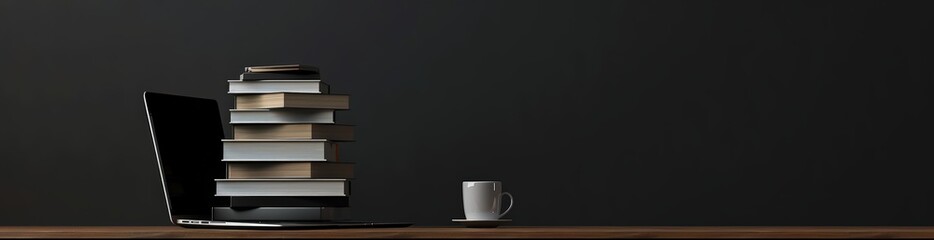 Laptop Books Against a Black Background. Concept Technology in Education